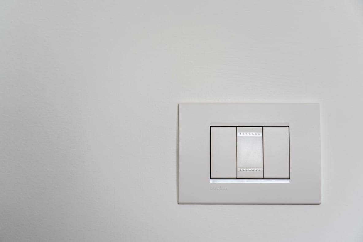 White Light Switch on White Painted Wall